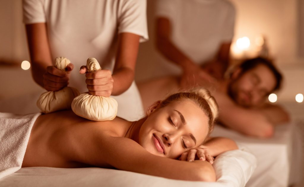 Couple,Enjoying,Herbal,Massage.,Relaxed,Husband,And,Wife,At,Exotic